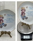 What is a Little Boy Decorative Plate on Brass Easel