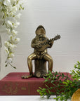 Melodic Croak: Vintage Brass Frog Guitarist on Stump Playing Guitar-Figurine