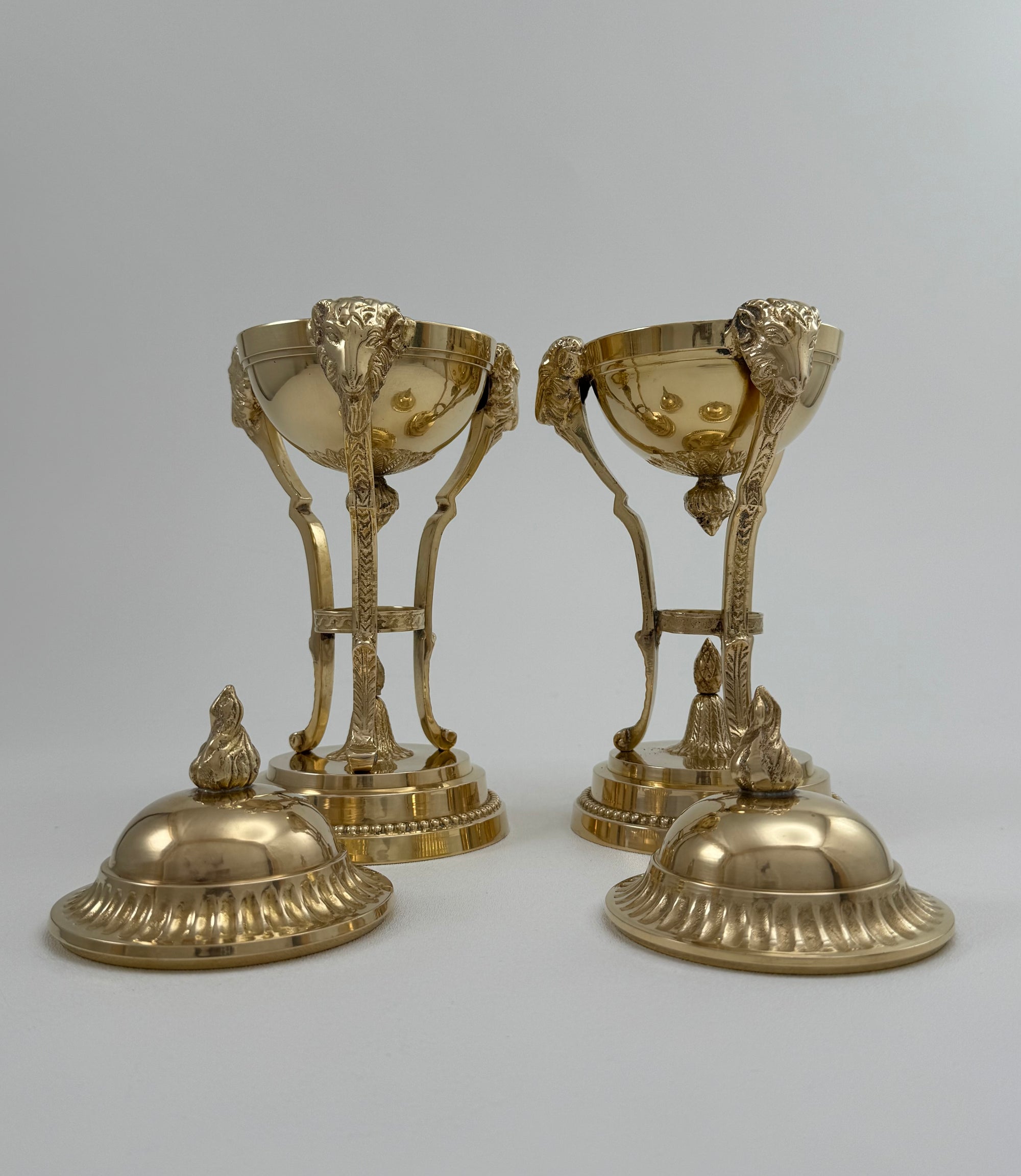 Pair of Vintage Brass Urns with Rams’ Heads &amp; Flame Finials