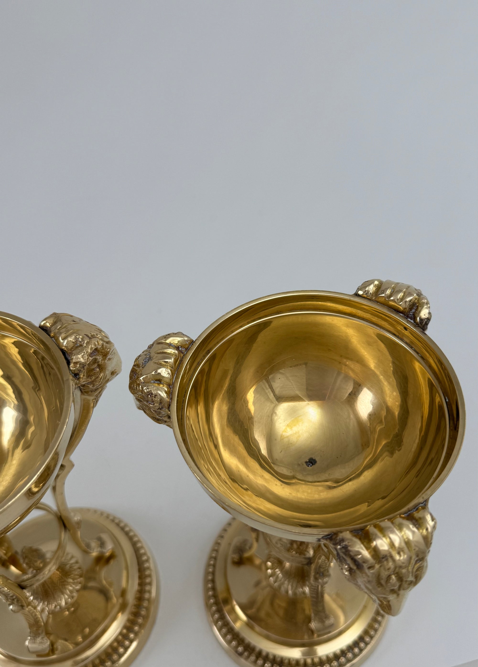 Pair of Vintage Brass Urns with Rams’ Heads &amp; Flame Finials