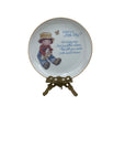 What is a Little Boy Decorative Plate on Brass Easel