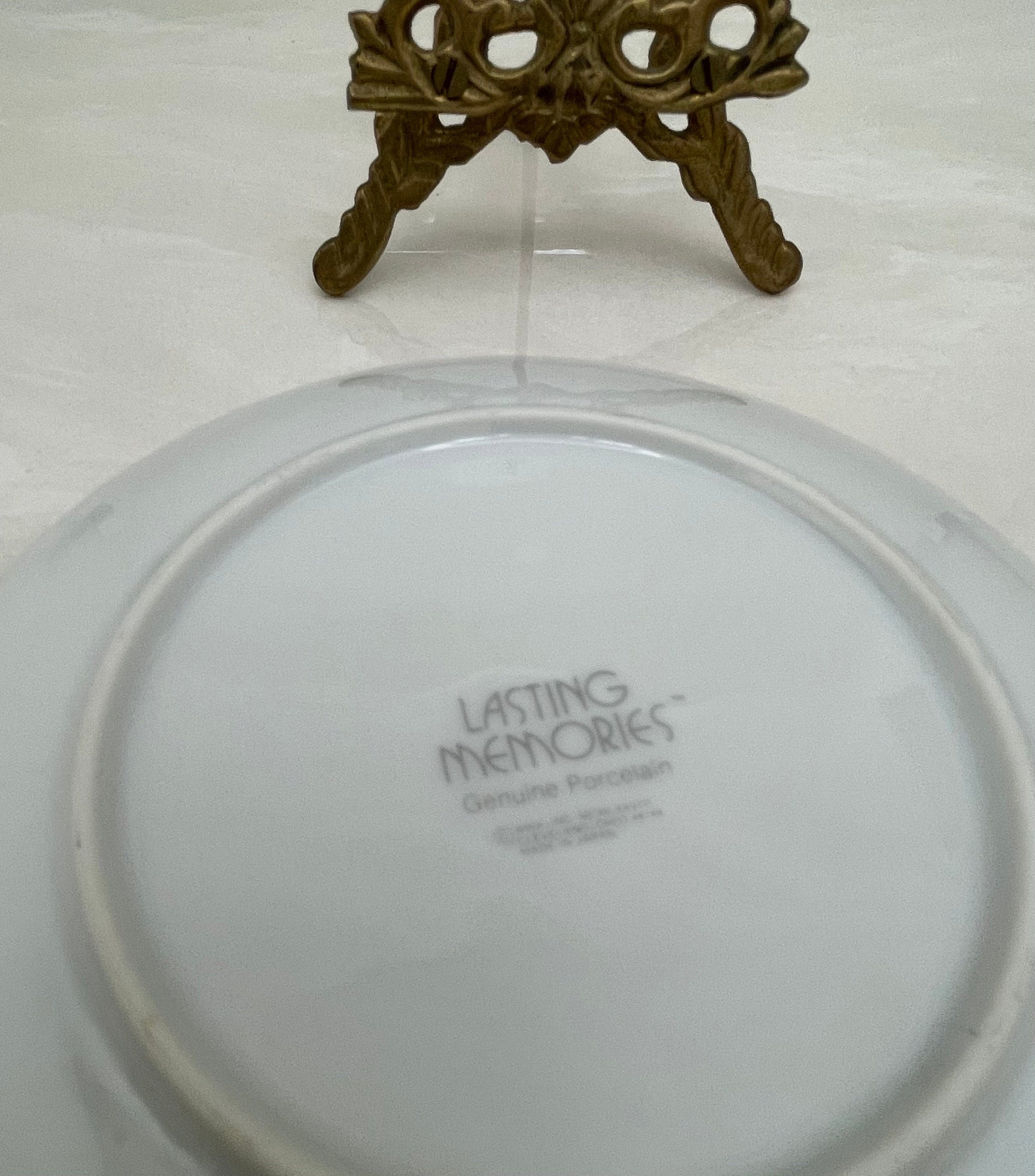 What is a Little Boy Decorative Plate on Brass Easel