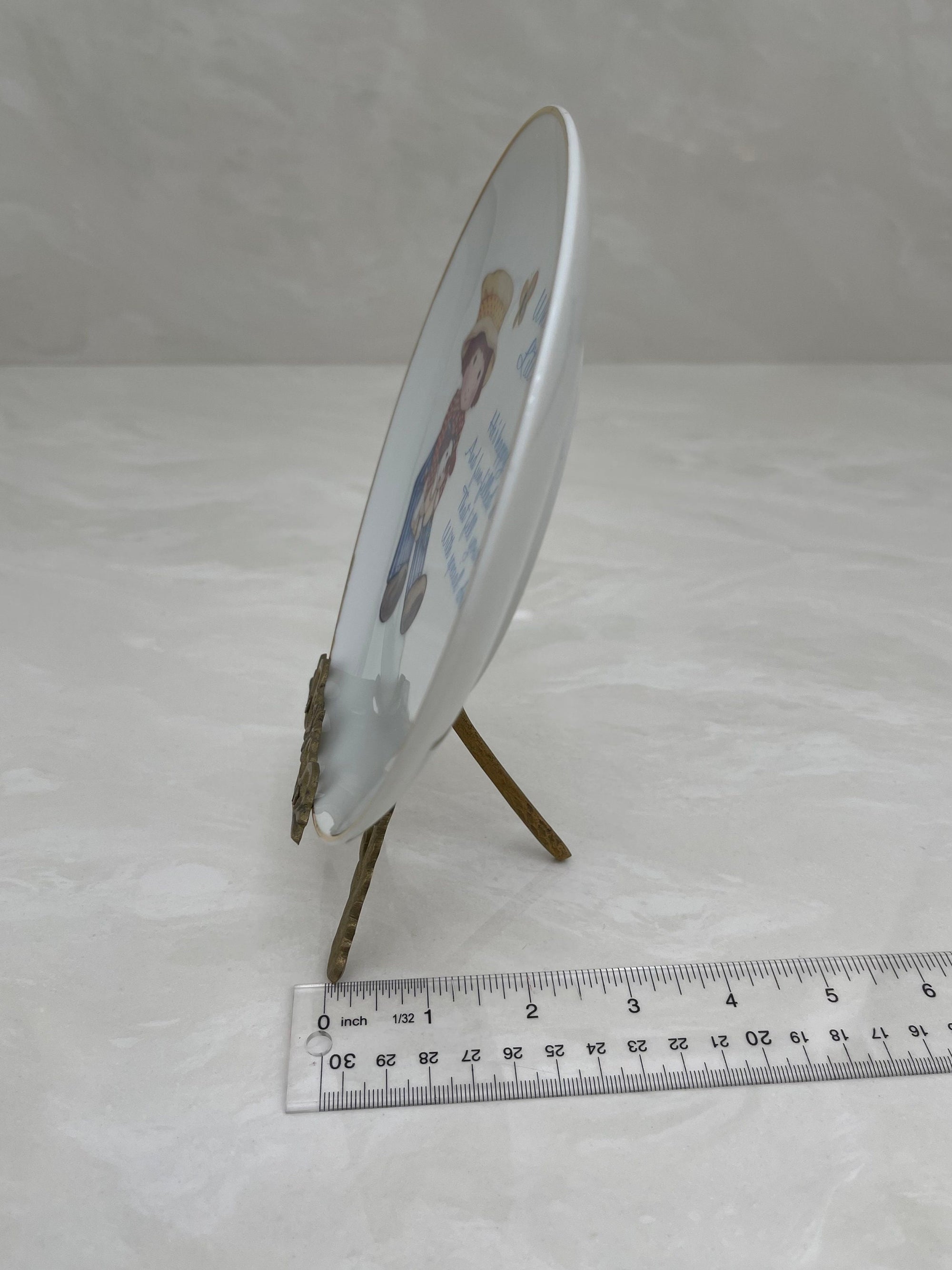 What is a Little Boy Decorative Plate on Brass Easel