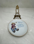 What is a Little Boy Decorative Plate on Brass Easel